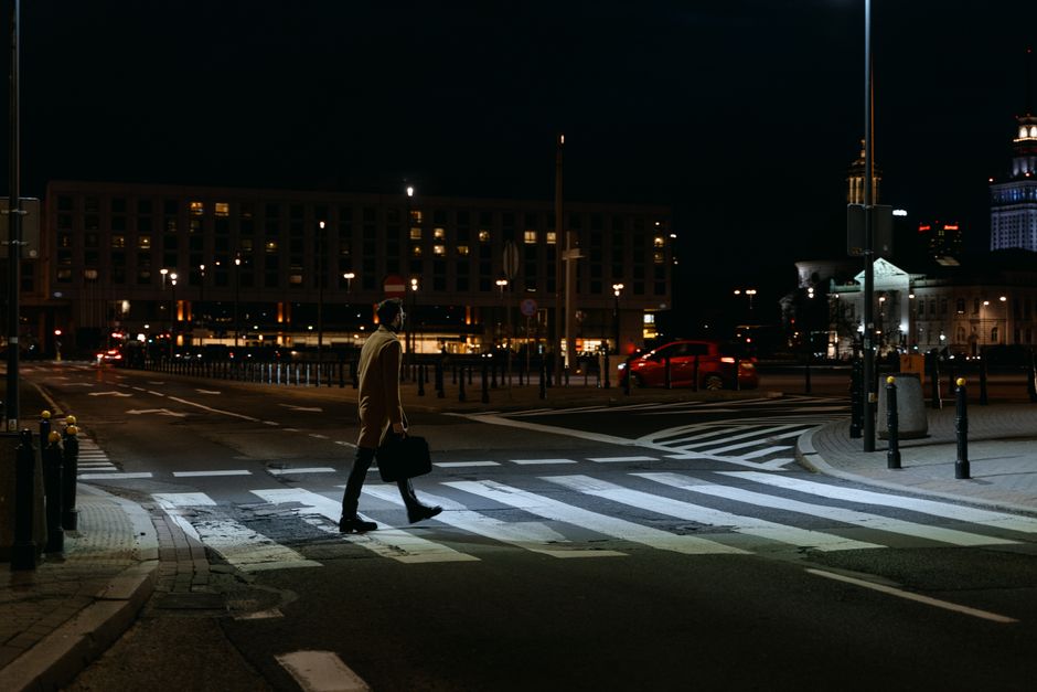 A person in a business suit stands at a fork in the road, symbolizing the fiduciary's dilemma and the critical choices they must make on behalf of their client.